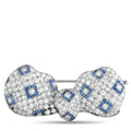 Art deco diamond and sapphire brooch with blue square accents and diamond pave