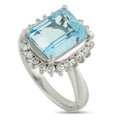 Platinum ring with aquamarine center stone and diamond halo, emerald-cut