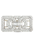 Diamond and platinum brooch with baguette center stone and round diamond frame