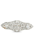 Diamond floral filigree brooch in silver-toned metal, oval center stone, hinged pin