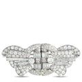 Platinum bow brooch with round and baguette-cut diamonds and rectangular center stones