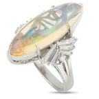 Exclusive Platinum 0.83ct Diamond and Opal Ring - Here is a luminous piece that transforms with every turn of the hand. This platinum ring carries a 7.58-carat marquise opal s