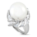 Platinum ring with large white pearl and baguette-cut diamond setting, openwork band