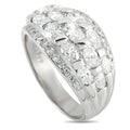 Platinum dome ring with clustered round diamonds and a pavé side band