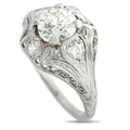 Platinum diamond ring with round center stone and ornate split-shank setting