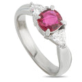 Platinum ring with oval pink ruby and small diamond accents, high-set bezel
