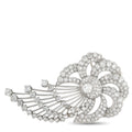 Platinum diamond brooch with floral ribbon design and round sparkling stones