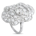 Silver-toned diamond cluster ring with round center stone and halo setting