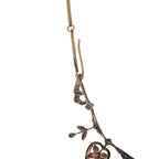 Rose gold diamond necklace close-up with adjustable loop and heart pendant