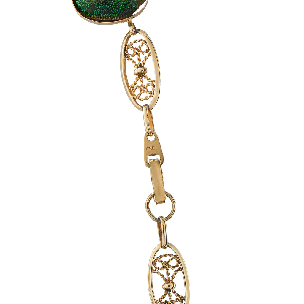 Rose gold tone necklace clasp with oval green motif and gold chain attachment