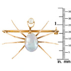 Rose gold-tone spider bar brooch featuring oval baroque pearl drop and round diamond top