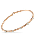 Exclusive 14K Rose and White Gold 0.52ct Diamond Bracelet Contrast, texture, and brilliance all in one polished design. This Exclusive  bracelet has an open bangle design, textured in