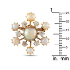 Rose gold pearl and diamond brooch displayed with mm scale ruler for size