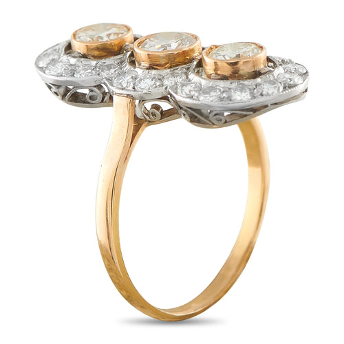 14K rose gold diamond ring with three round stones and halo settings