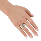 14K rose gold diamond halo ring with swirling cluster design on hand