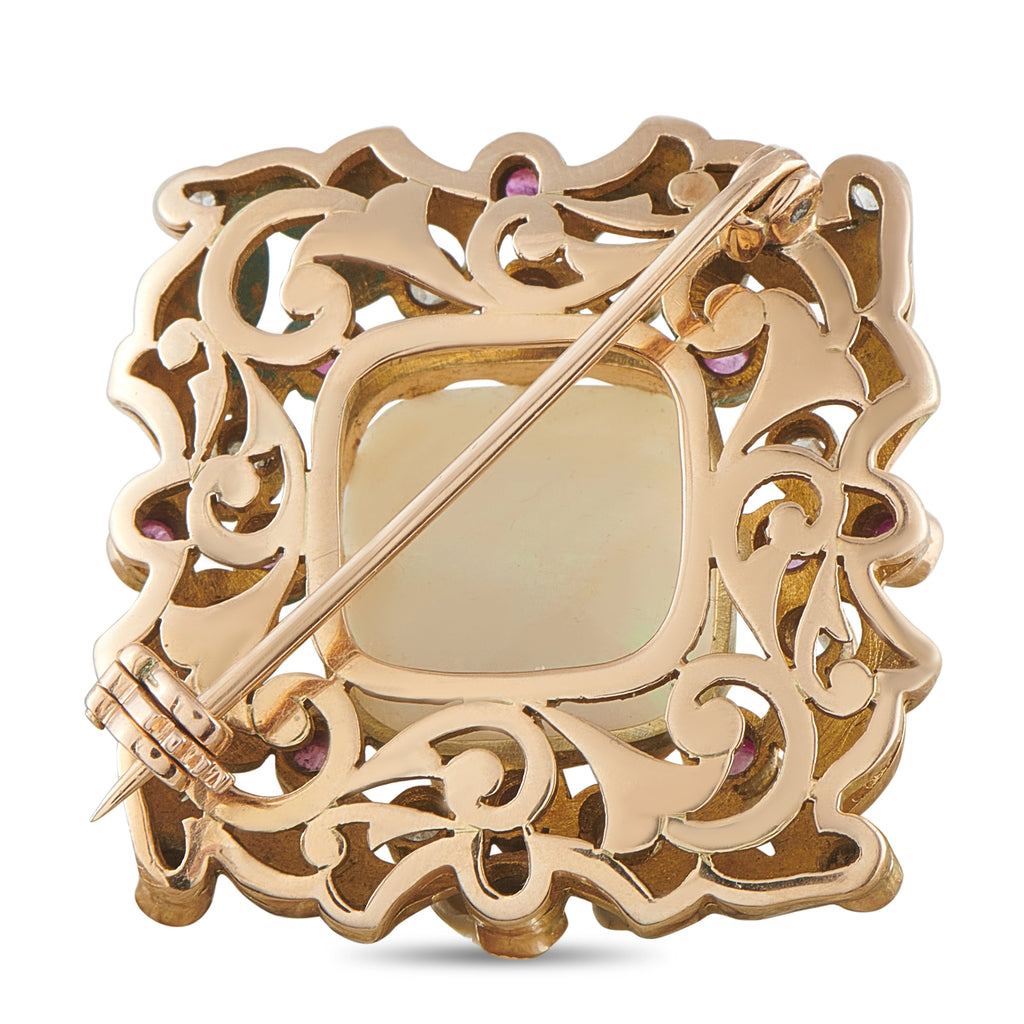 Gold filigree enamel brooch with pin clasp and pink stone accents