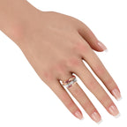 Rose gold ring with rubies and diamonds on finger