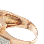 Rose gold ring band close-up with diamond detail and hallmark