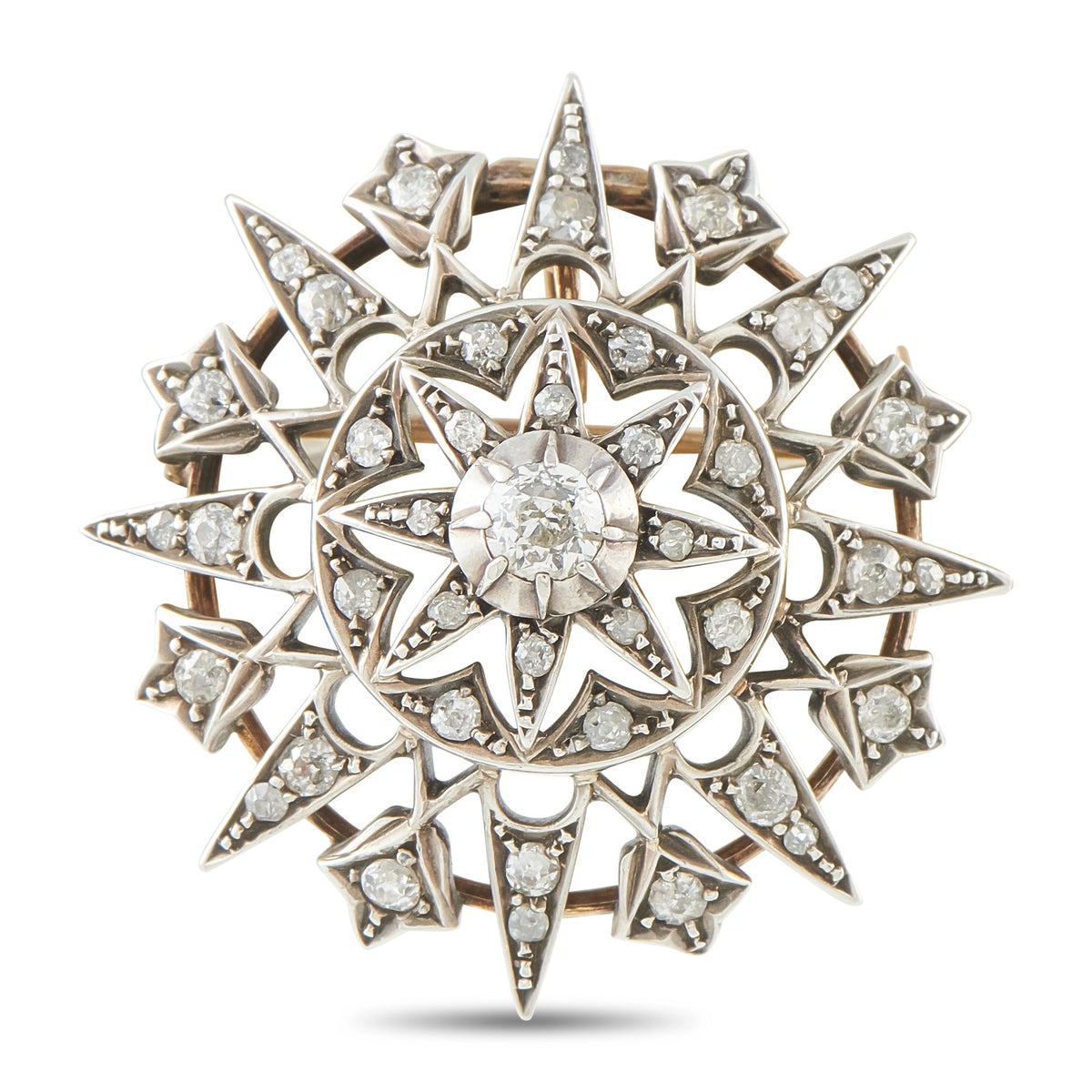 Antique diamond starburst brooch in rose-gold and silver-tone, old-cut center stones