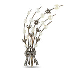 Antique spray brooch with white pearls, diamond accents, and dark metal branches