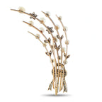 Antique spray brooch with rows of white pearls and diamond-like accents on gold-toned metal