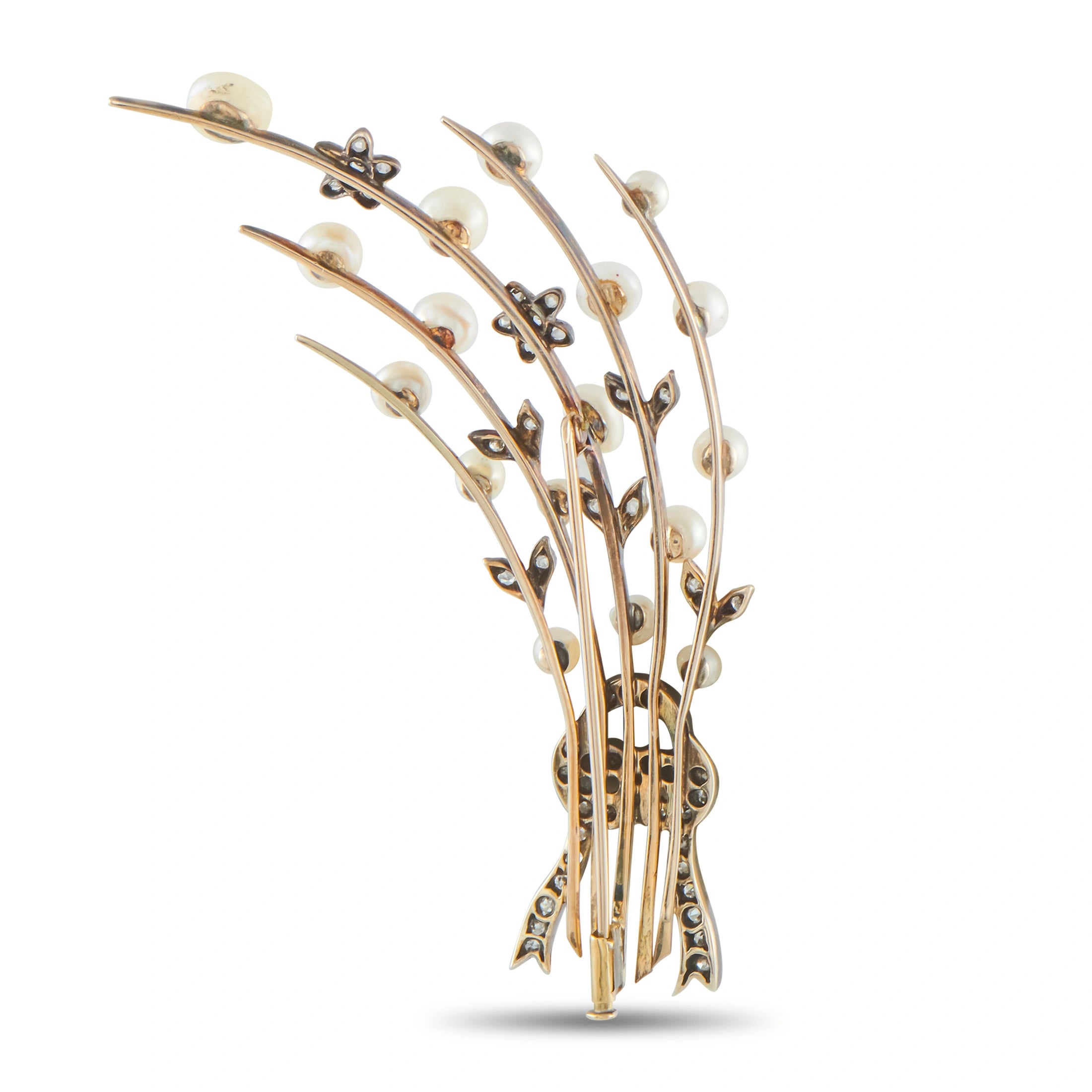 Antique spray brooch with rows of white pearls and diamond-like accents on gold-toned metal