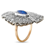 Antique sapphire diamond halo ring, blue oval center, gold band with silver prongs