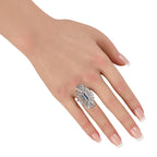 Antique sapphire diamond halo ring on hand, blue oval center, two-tone metal band