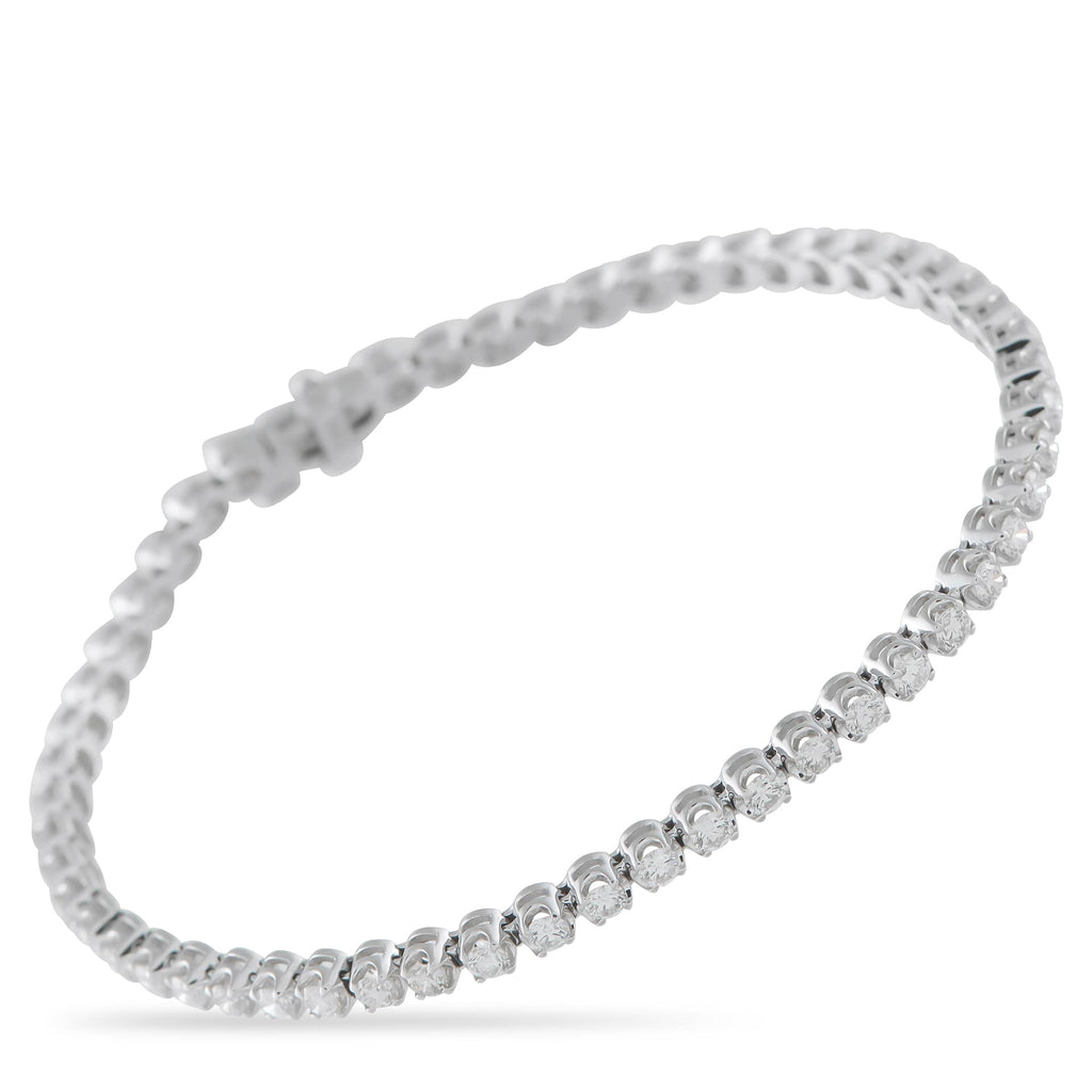 Exclusive 14K White Gold 3.0ct Diamond Tennis Bracelet More than a standard tennis bracelet, this Exclusive  piece boasts an open basket design that allows light to pour in from al