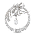 14K white gold diamond brooch with bow-and-drop floral design