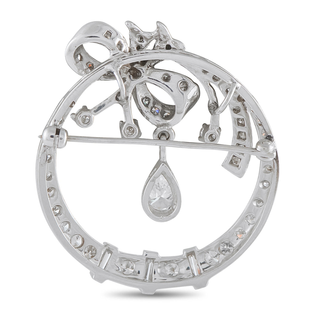 14K white gold diamond brooch with openwork circular frame