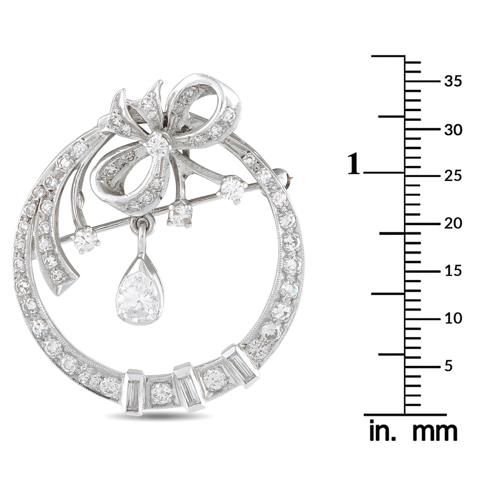 14K white gold diamond brooch with dangling pear-shaped drops and bow