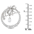 14K white gold diamond brooch with dangling pear-shaped drops and bow
