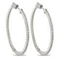 Inside-out diamond hoop earrings in white gold, hinged clasp detail on oval hoop