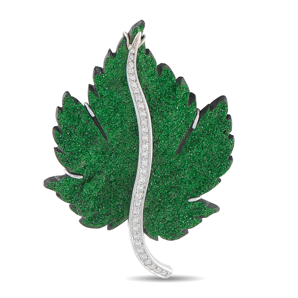 Leaf brooch in white gold with green Uvarovite stones and diamond accents