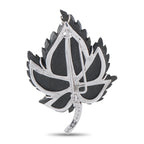 Back view leaf brooch in white gold with green stone leaf and diamond trim
