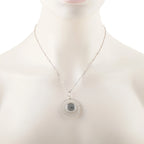 Round light-blue clock-face pendant with diamond bezel on silver chain