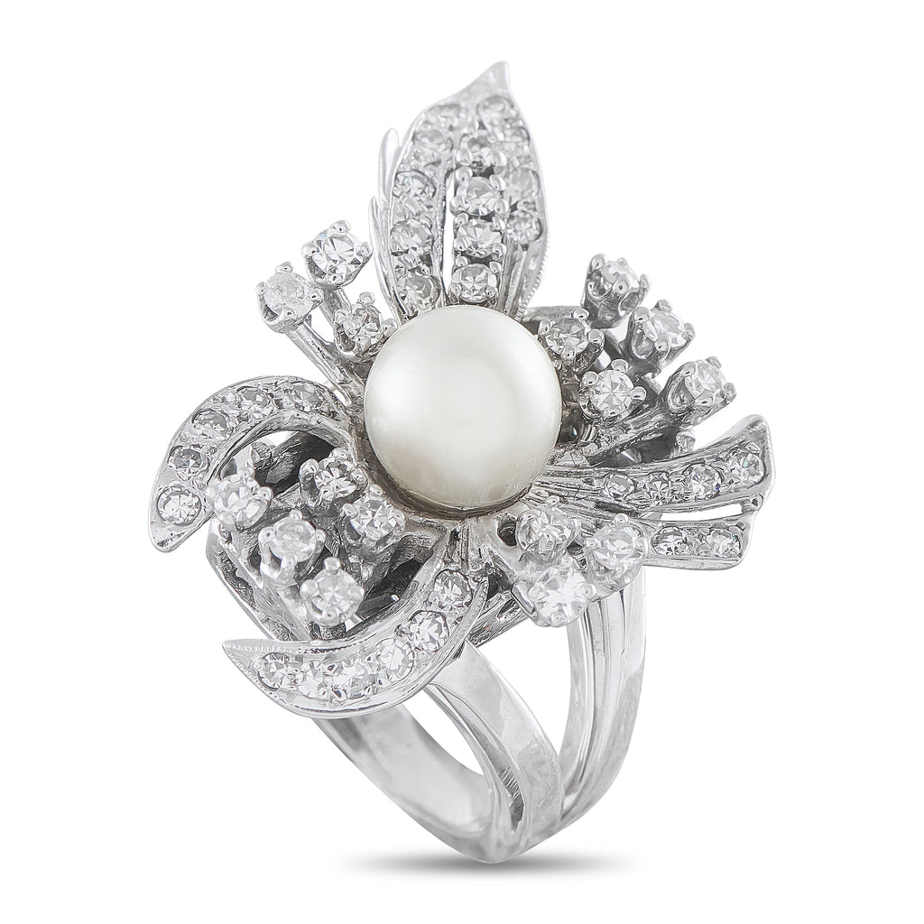 White gold floral cocktail ring with pearl center and diamond petals