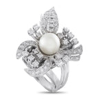 White gold floral cocktail ring with pearl center and diamond petals