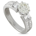 White gold diamond ring with oval center stone and baguette side accents