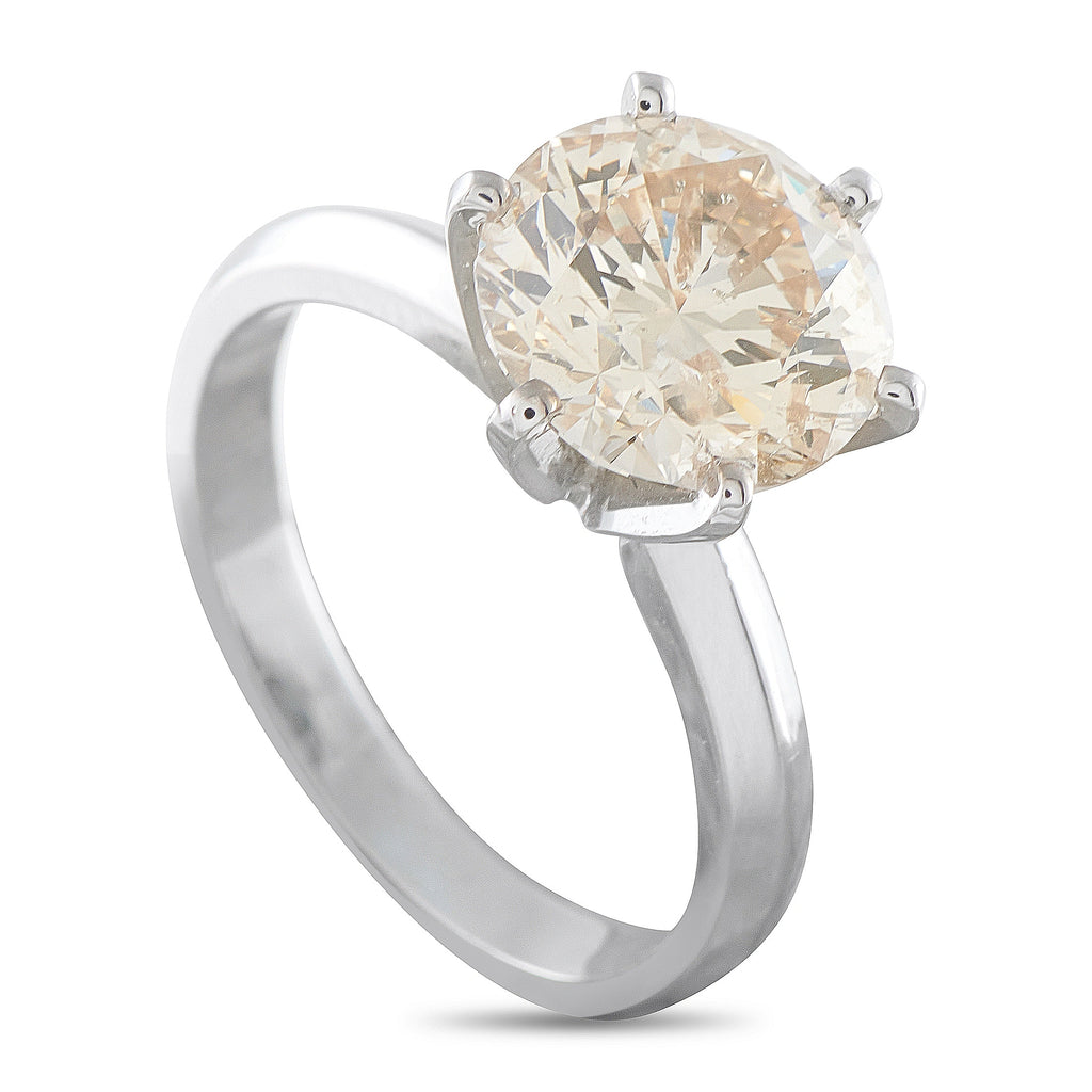 14K white gold solitaire ring with large round diamond, four-prong setting