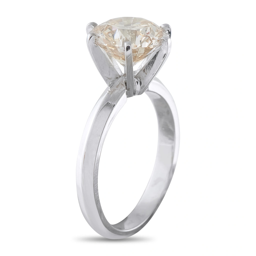 14K white gold solitaire ring with round diamond center and four-prong setting