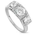 14K white gold three-stone diamond ring, oval center with two side stones