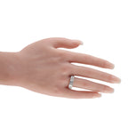 White gold diamond ring on a hand, showcasing a band of stacked stones