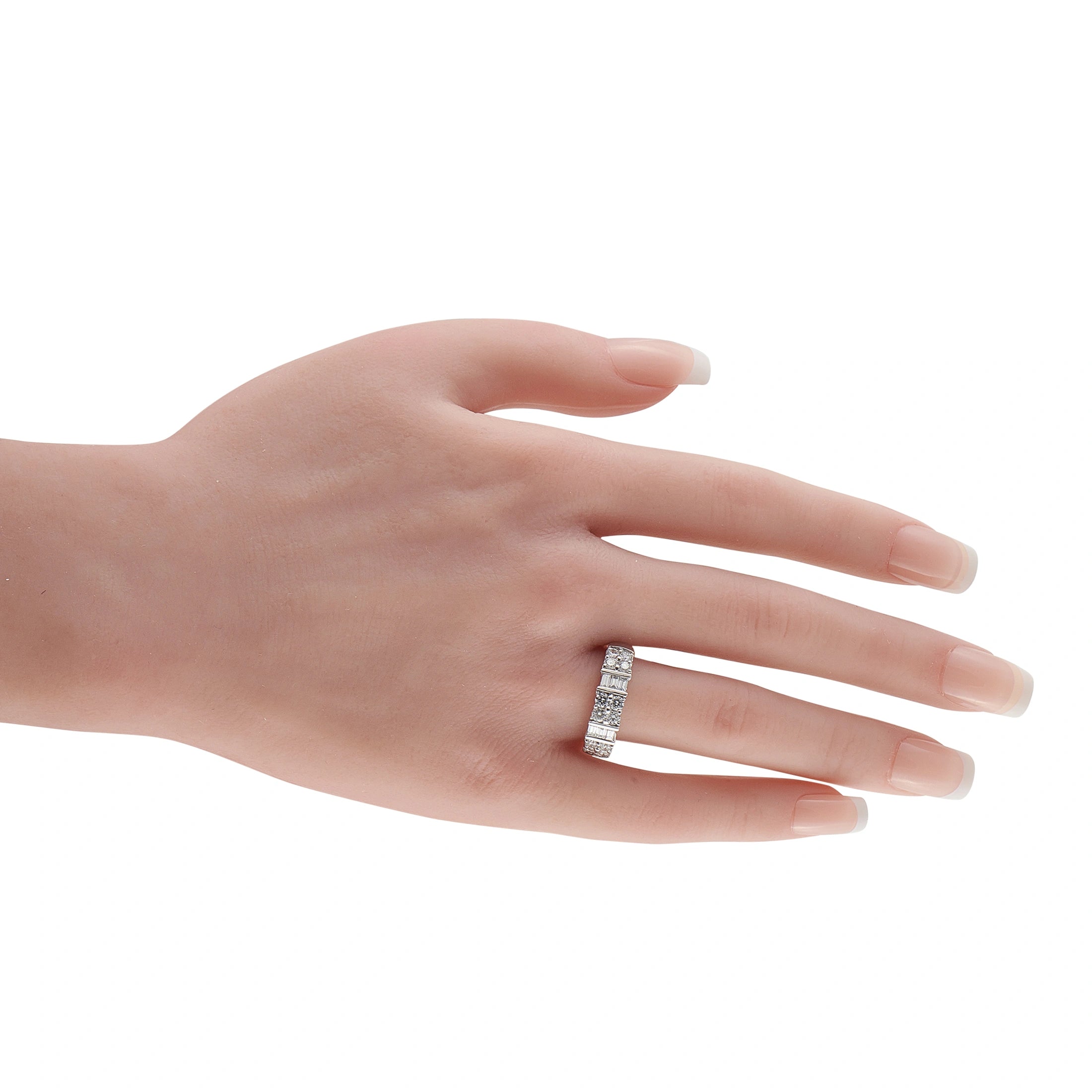 White gold diamond ring on a hand, showcasing a band of stacked stones