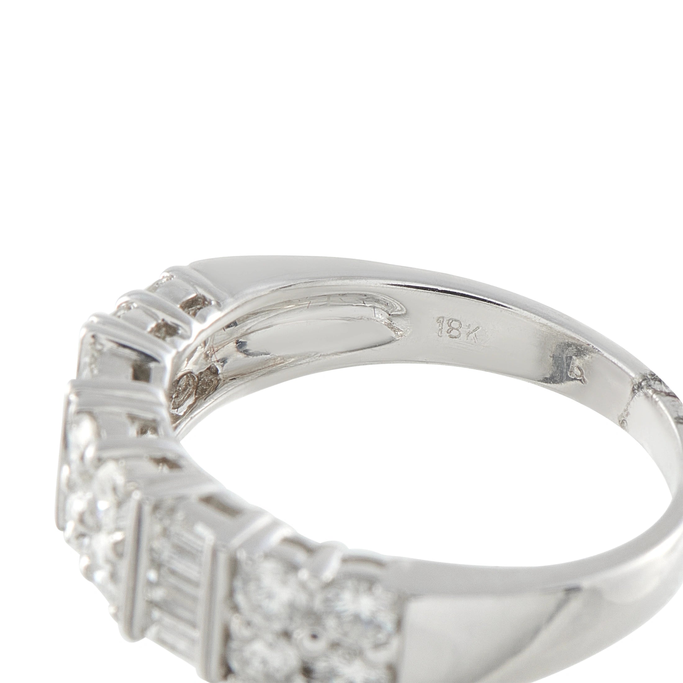 White gold diamond ring with inner hallmark stamp visible on the band