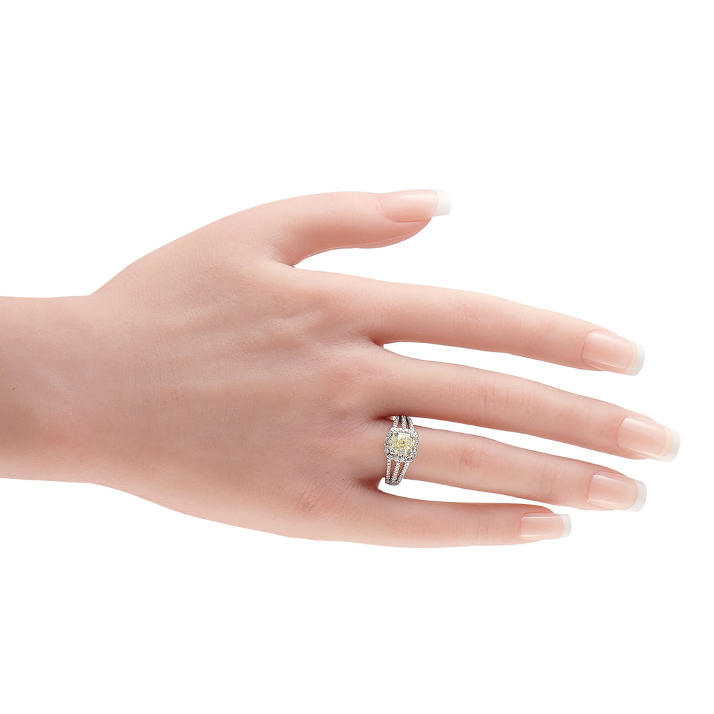 14K white gold diamond ring with yellow center stone on finger