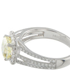 14K white gold ring close-up with yellow center diamond and engraved settings