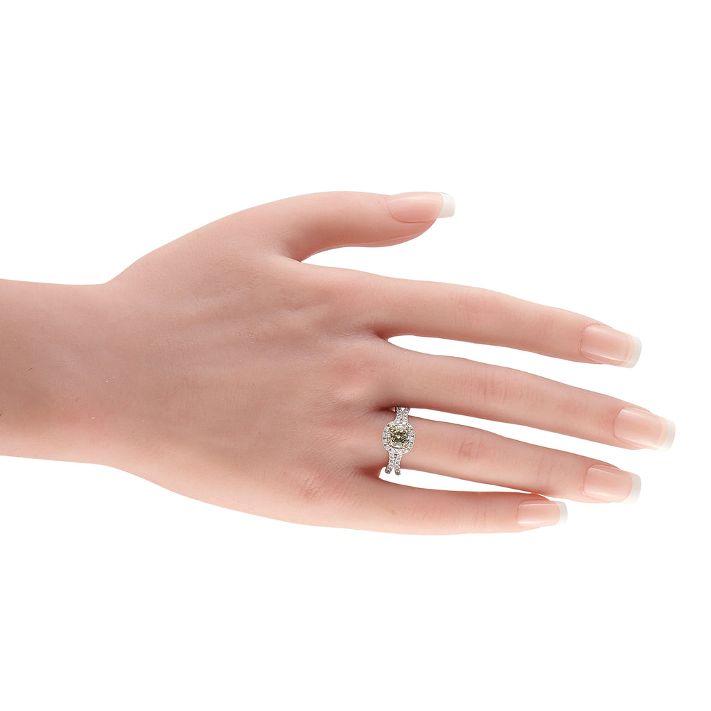 14K white gold fancy yellow diamond halo ring on a hand