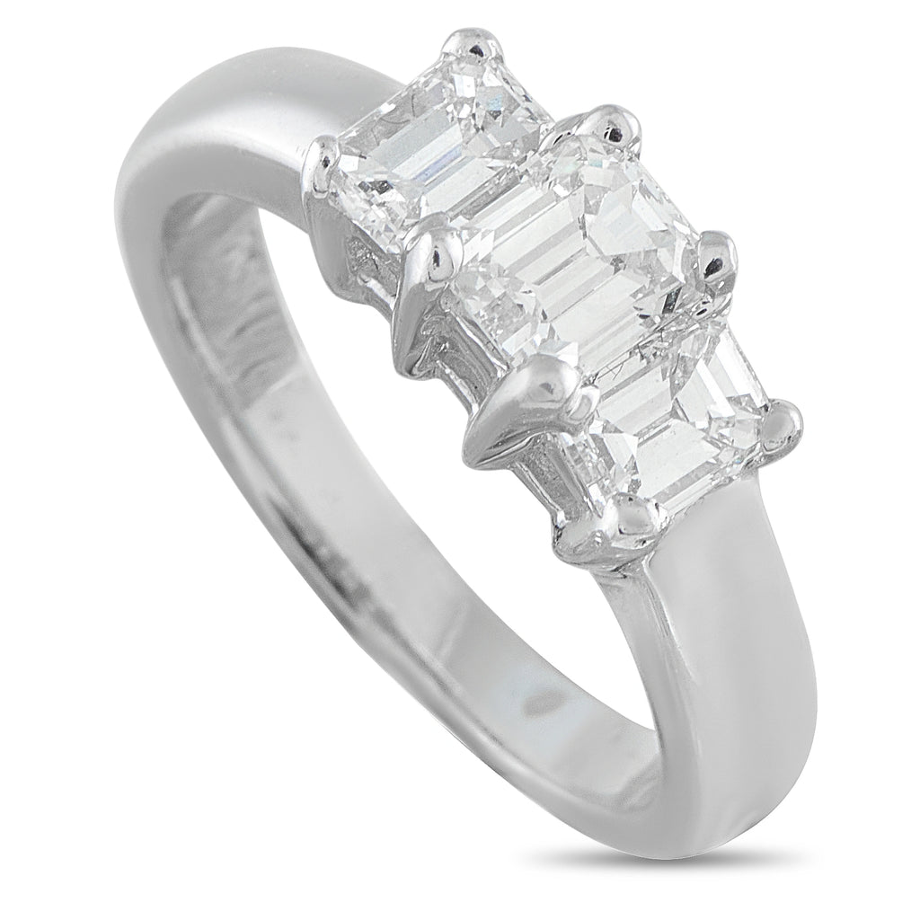 14K white gold three-stone diamond ring with emerald-cut center and side stones